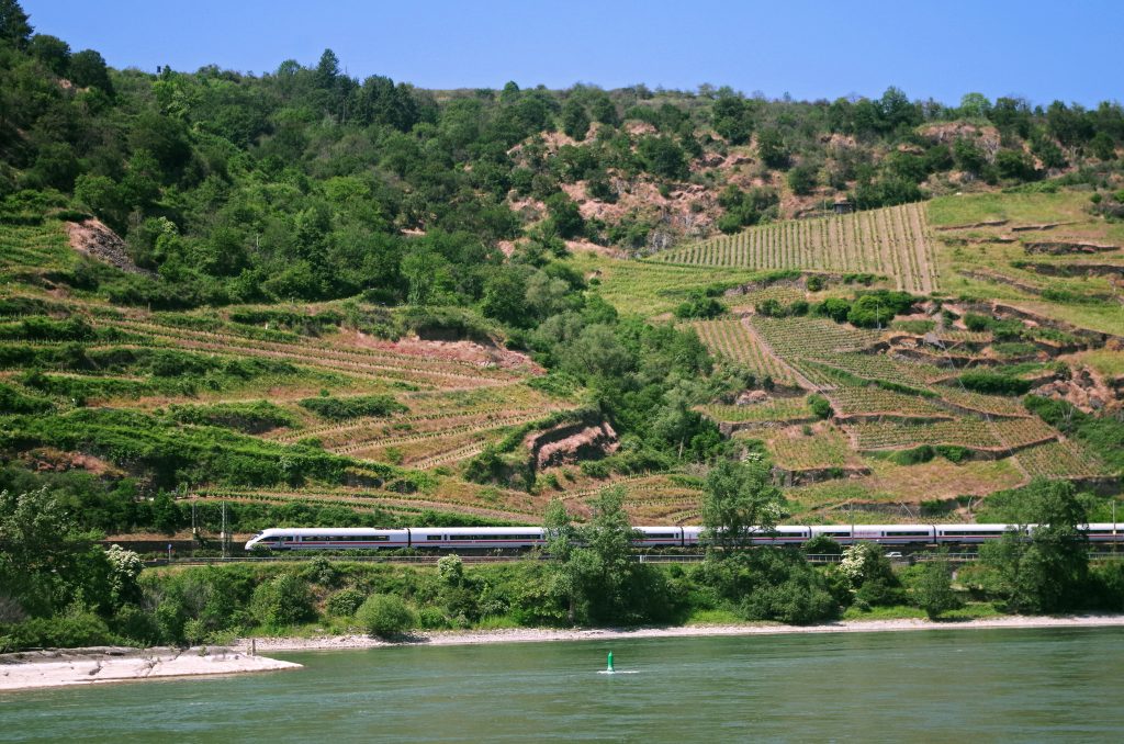 A high-speed passenger train along the route from Rüdesheim to Cologne